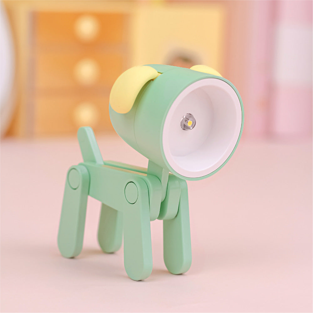 Lampe de bureau articulé en forme de chien de couleur verte avec abat-jour garni d'oreilles de couleur jaune. La figure est l'ampoule.
