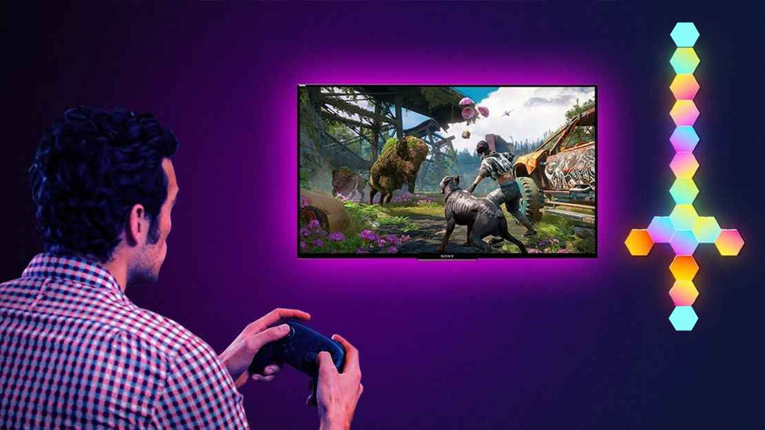 On voit 16 appliques murales intérieurs formant un sabre installé sur le mut prÚs d'un écran plat sur lequel s'affiche le jeux du gamer qu'on voit jouer à ce dernier.