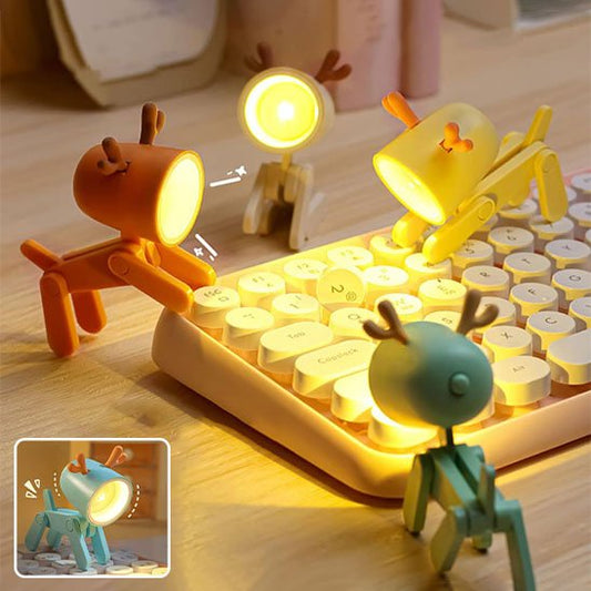 Quatre lampes en forme de reine, une orange, une beige, une verte et un jaune qui est sur les touches d'un clavier, Leurs panaches sont de couleurs oranges. Un encarts présente la lampe de couleur bleu.