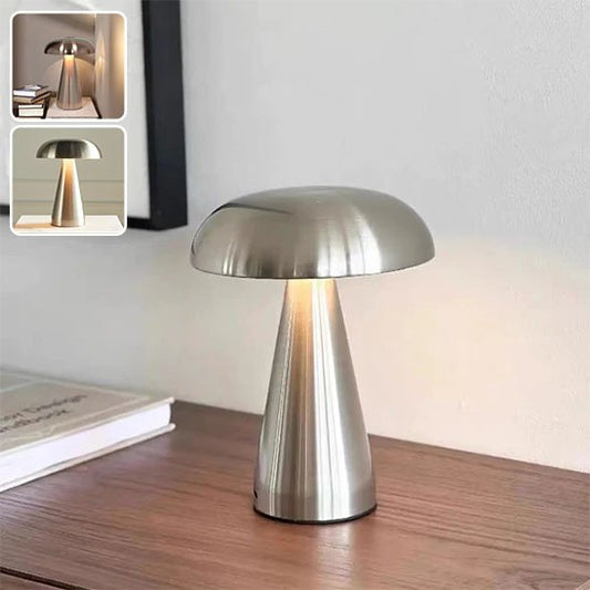 Lampe en forme de champignon de couleur argent sur une bureau. Deux encarts montre les couleurs Or et bronze.