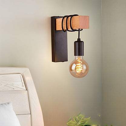 L'applique mural | Design Scandinave noire installée sur le mur d'une chambre près d'une tête de lit lanche.