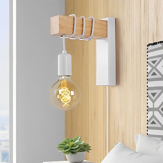 applique mural | Design Scandinave de couleur blanche installée au-dessus d'une table de chevet près d'un lit.
