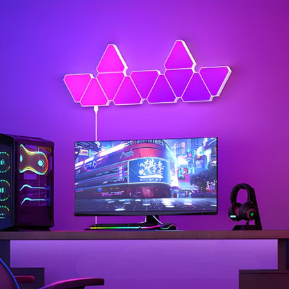 On voit 11 appliques murales interieur | Design Reuleaux installées au mur d'un espace bureau qui illuminent la pièce dans un dégradé de couleurs qui sont du rose au mauve